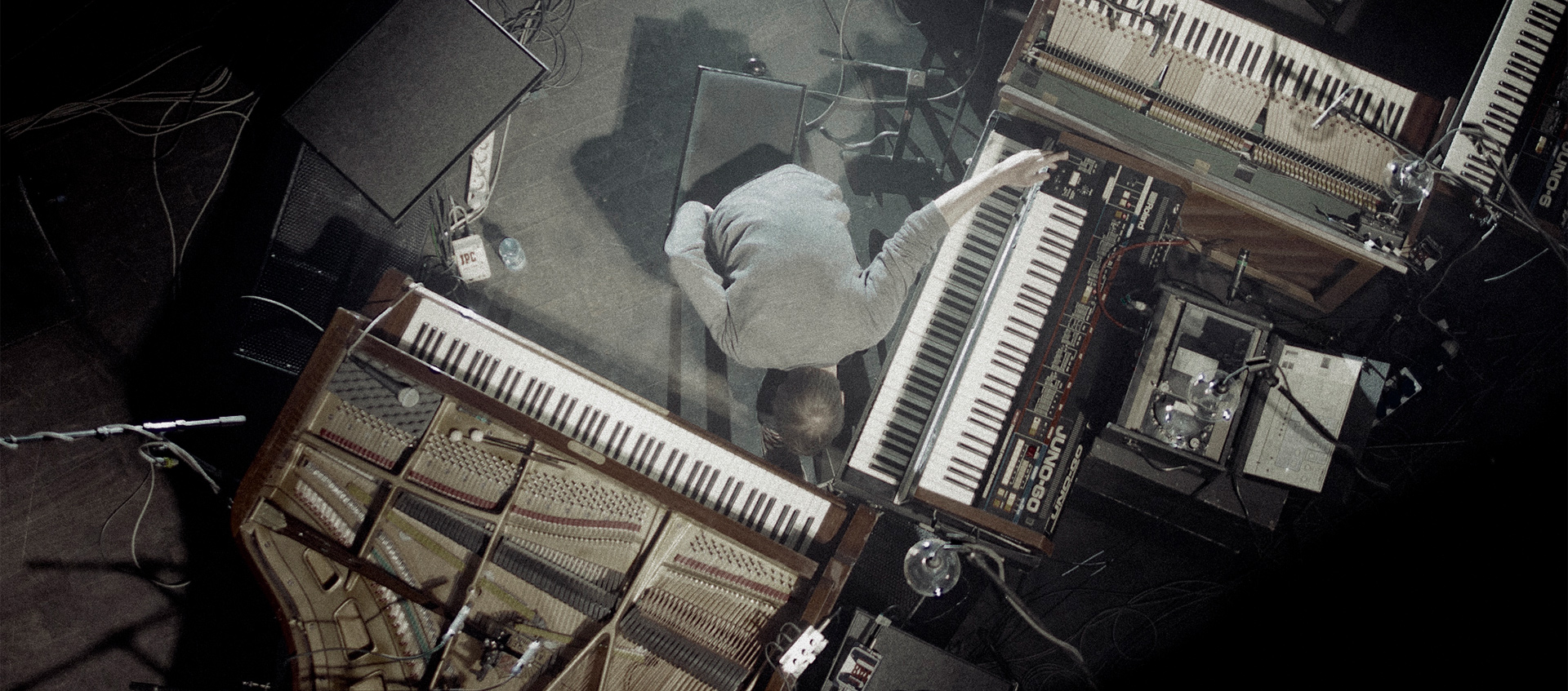 Arial shot of Nils Frahm playing piano