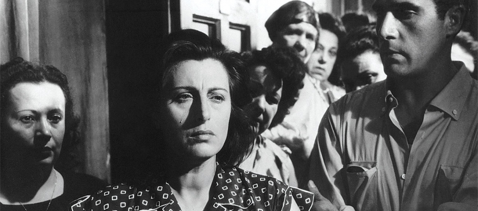 Magnani in crowd looking off camera