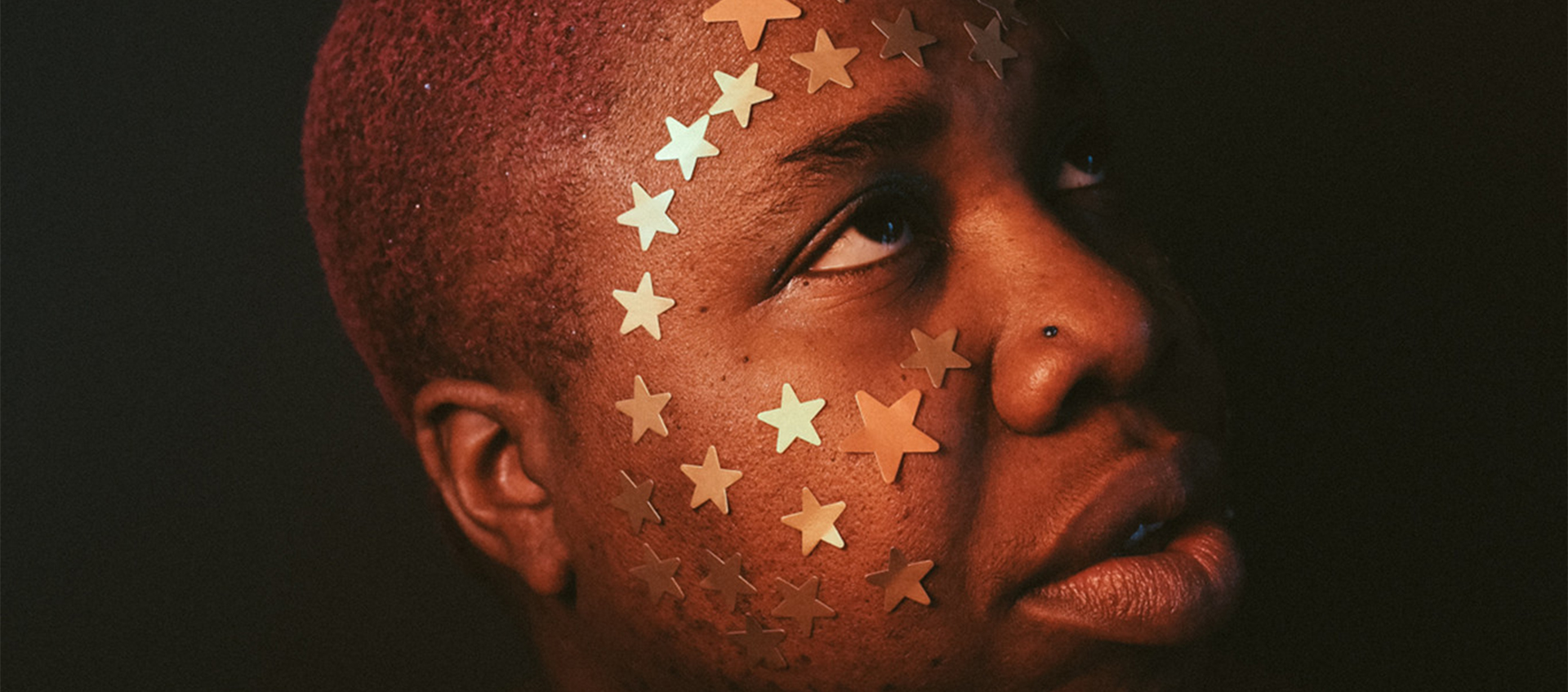 man with stars on face