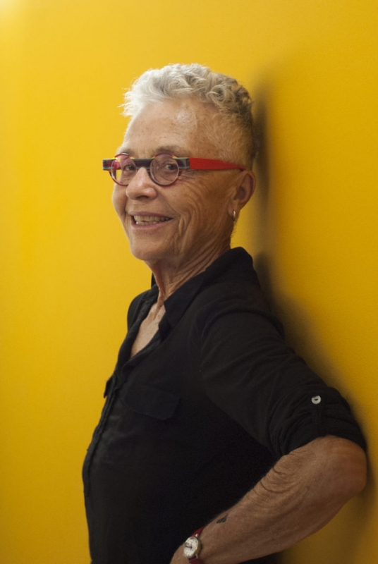 a portait of barbara hammer against a yellow background
