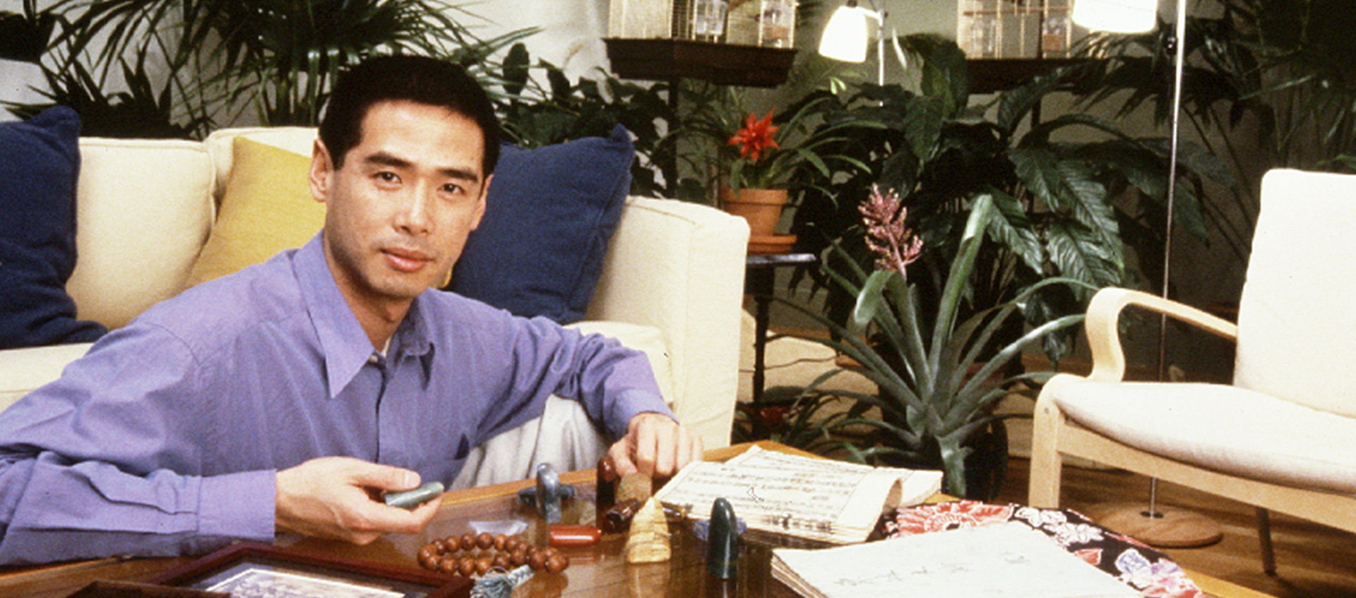 Lee Mingwei seated at a table