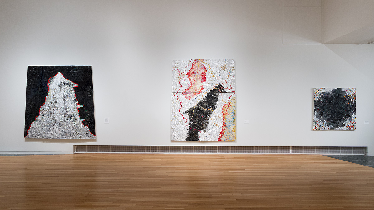 Line-up of three Jack Whitten paintings in the Wexner Center galleries