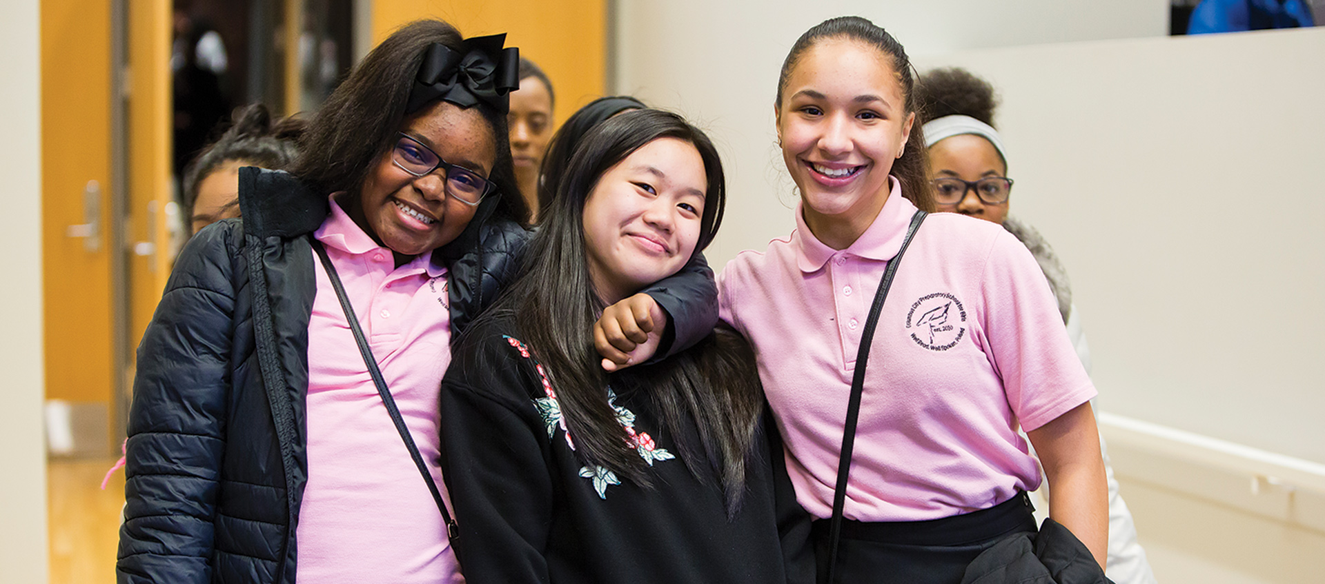 Three students pose for a photo