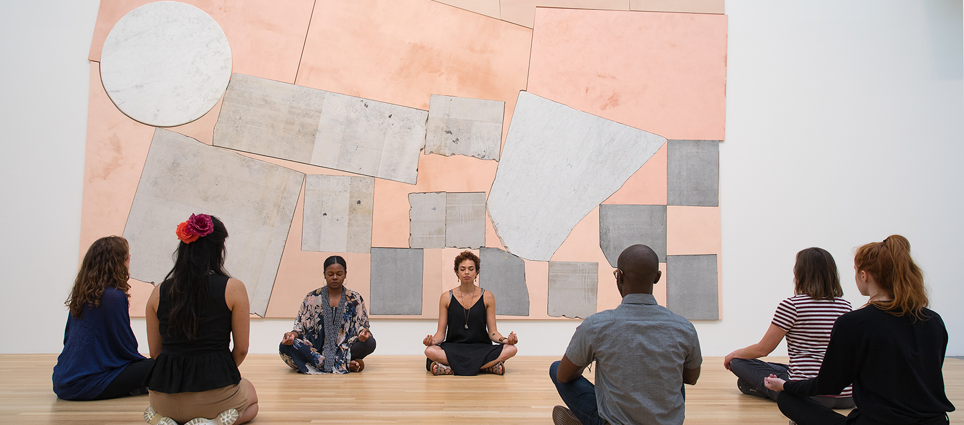 Patrons meditate in the galleries