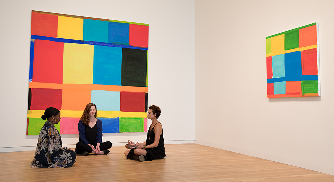 Patrons meditate in the galleries