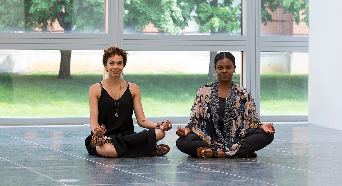 Patrons meditate in the galleries