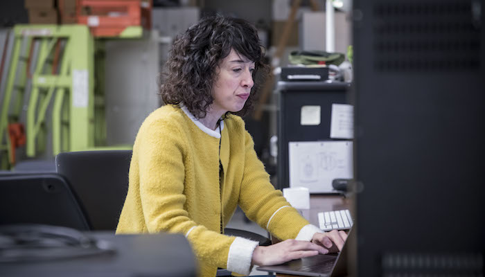 Artist and filmmaker Hope Ginsburg works on her laptop computer in the Wexner Center Film/Video Studio in October 2018.