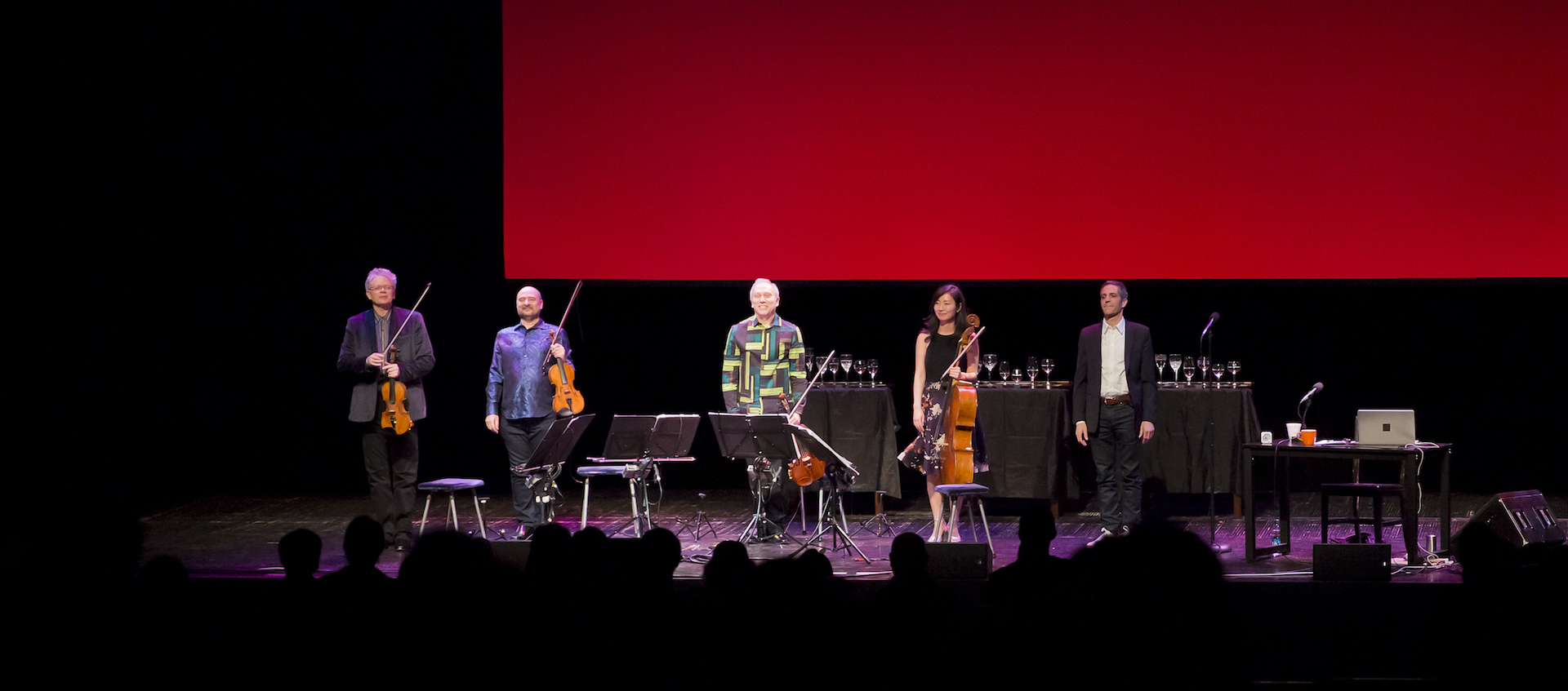 The members of Kronos Quartet stand on the stage of Mershon Auditorium at the Wexner Center for the Arts following the January 25 world premiere performance of "A Thousand Thoughts: A Live Documentary by Sam Green and Kronos Quartet"