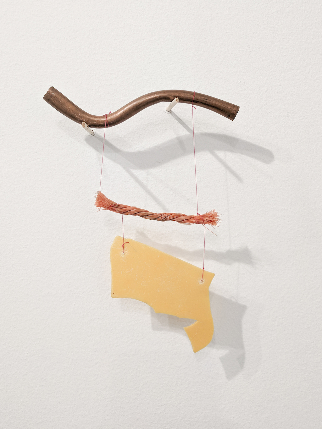 Cecilia Vicuña Tres elementos (Precarios) Mixed media 6 7/8 x 5 3/4 x 1/4 in.  Courtesy of the artist and Lehmann Maupin, New York, Hong Kong, and Seoul.