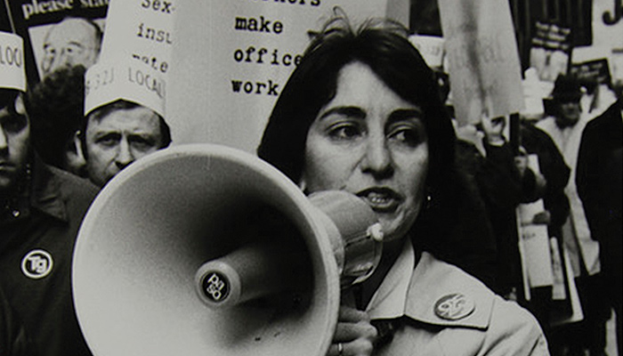 Image of woman with bullhorn from 9to5: The Story of a Movement
