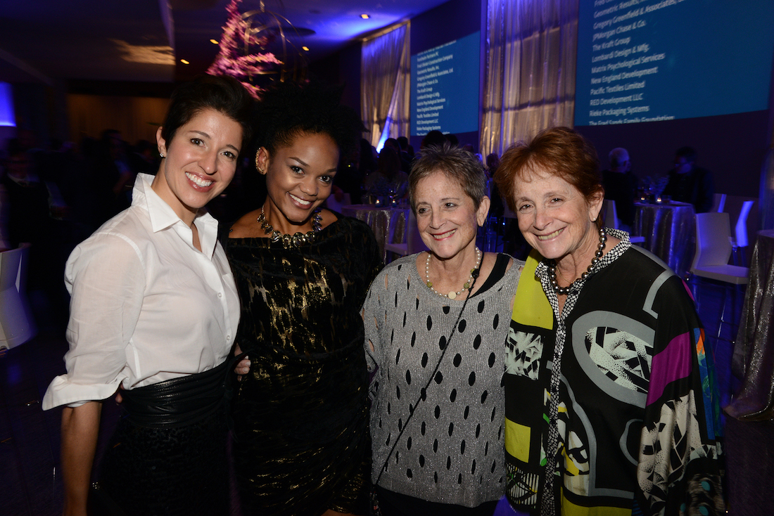 Wexner Center members Christina Ceresoli, Jessica Burton, Janice Roth and her sister, Joyce Shenk, huddle together for a picture in the lobby of Mershon Auditorium during the 2017 anniversary party for the Wexner Center for the Arts at The Ohio State University. 