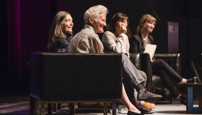 Artists Ann Hamilton, Jenny Holzer, and Maya Lin sitting on the stage of Mershon Auditorium, discussing their work with Wexner Center director Johann Burton as part of opening events for the fall 2019 exhibition HERE at the Wexner Center for the Arts. Photo by Katie Gentry