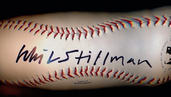 An elongated scanned image of a Rawlings baseball signed by filmmaker Whit Stillman, from the collection of projectionist Bruce Bartoo