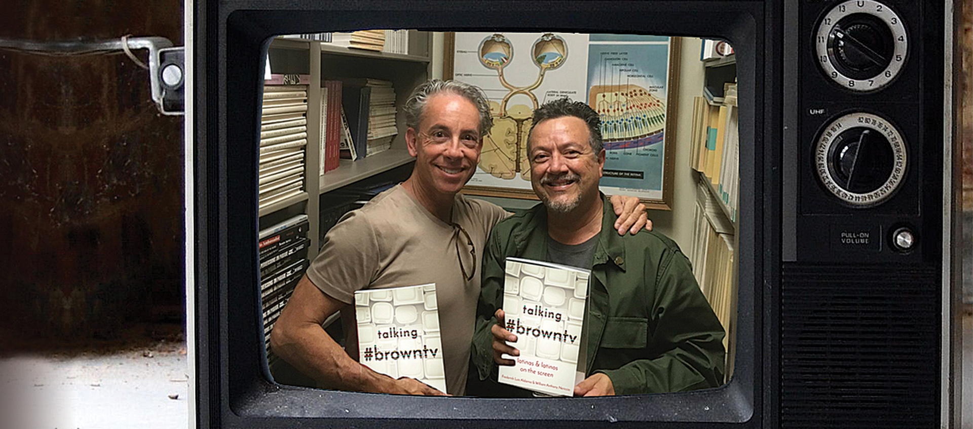  Frederick Aldama and William Nericcio holding their book Talking #browntv