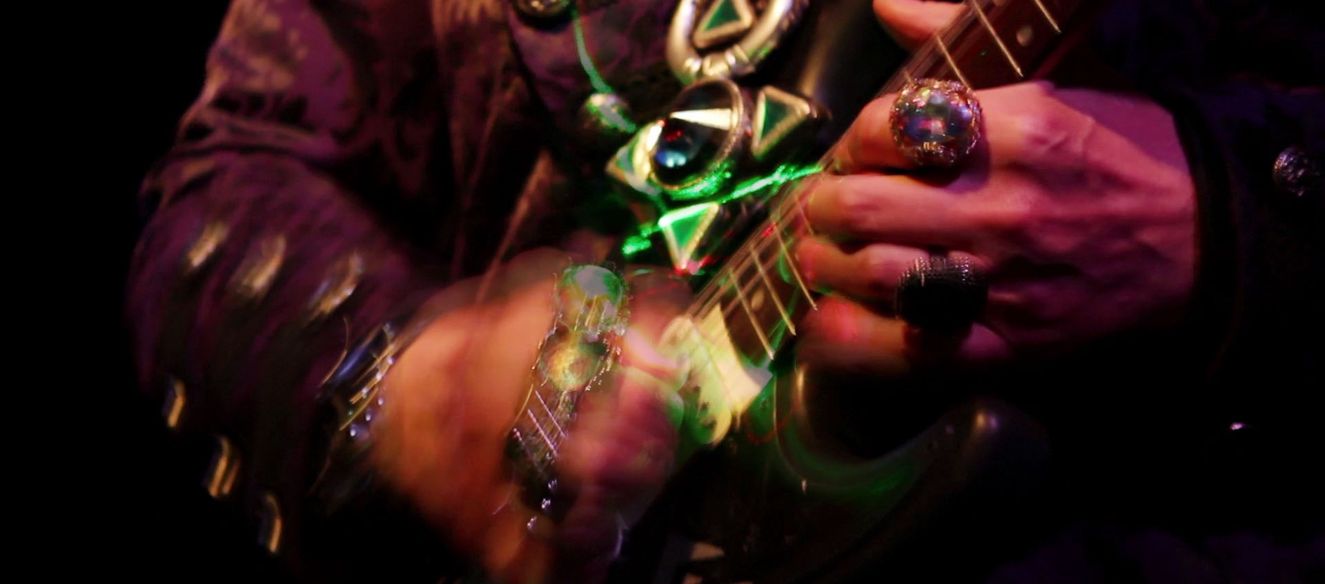 Image of hands playing an electric guitar from the Lori Felker Film Future Language: The Dimensions of VON LMO