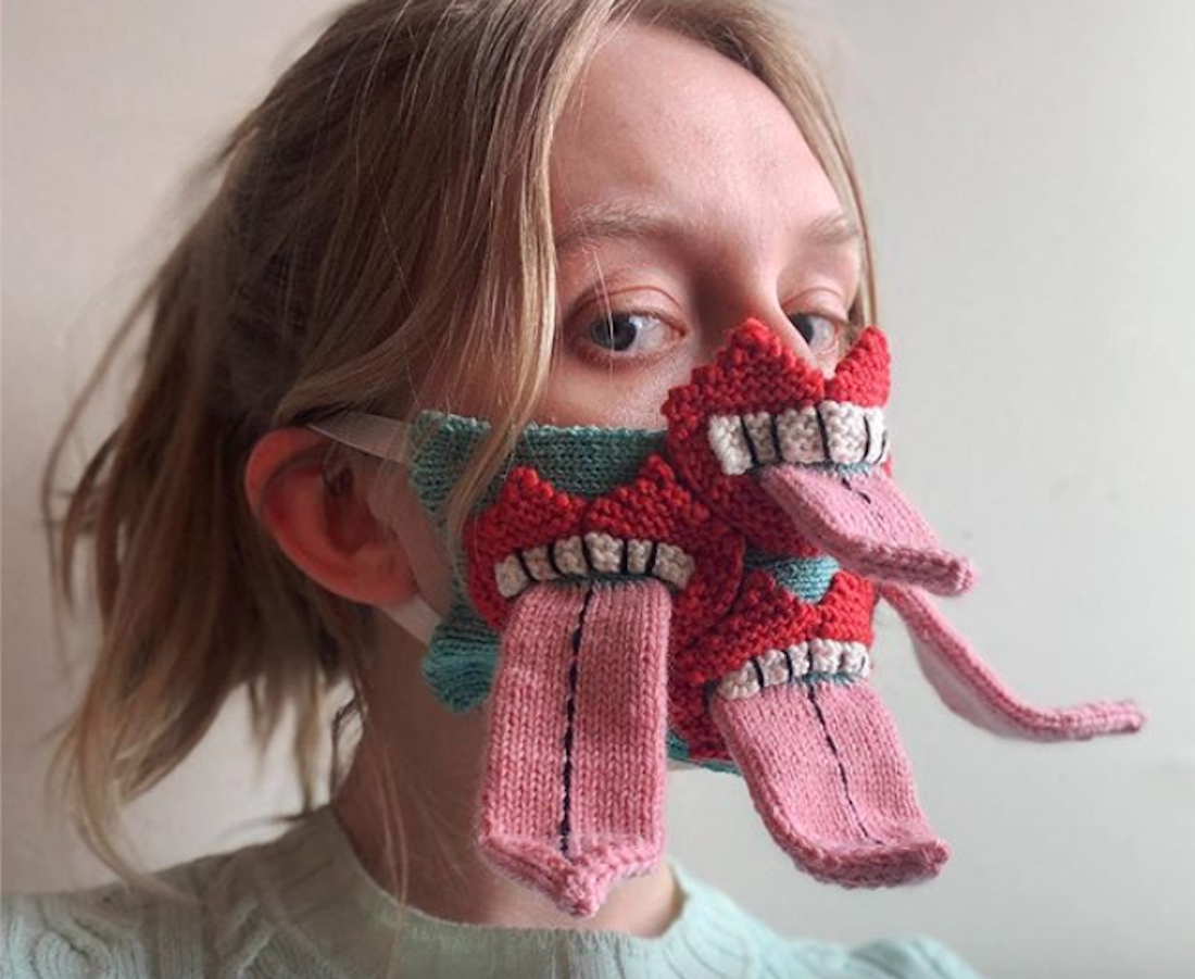 Icelandic artist Ýr Jóhannsdóttir models her hand knit face mask, covered in mouths with outstretched tongues