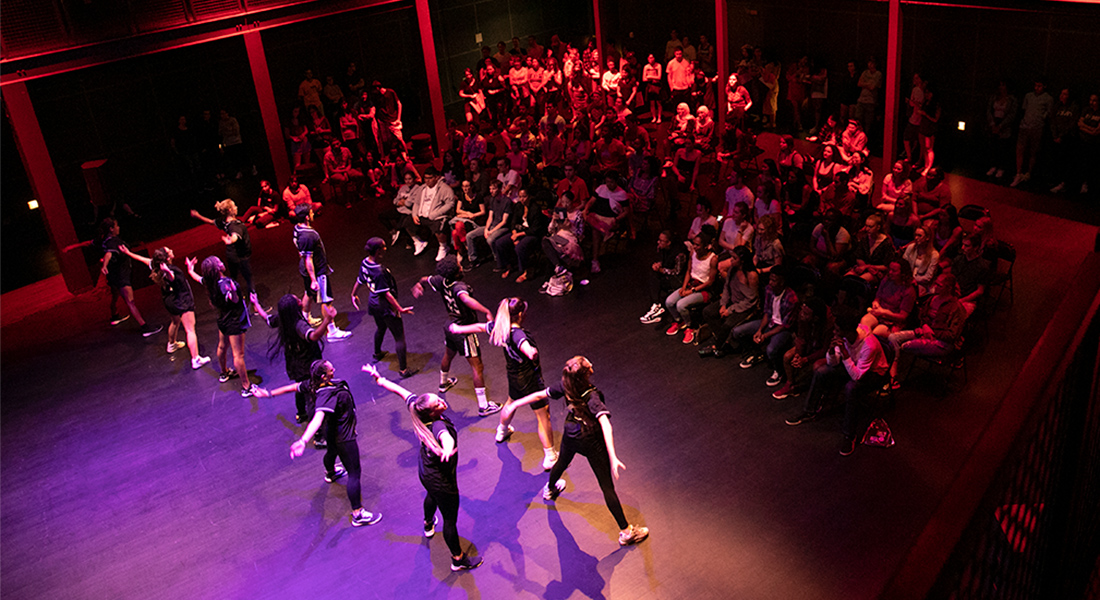 Dancers perform in front of a crowd at a Wex Student Party