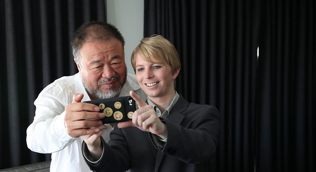 Artist Ai Weiwei takes a selfie with whistleblower Chelsea Manning