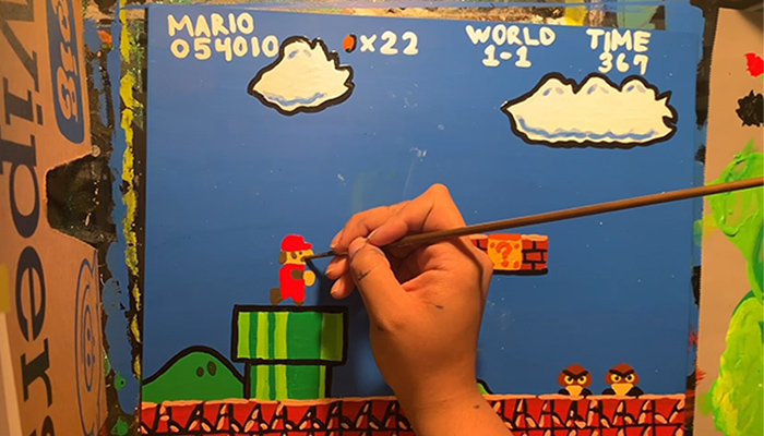 Artist Bethani Blake paints a miniature environment inspired by Original Mario Bros videogame