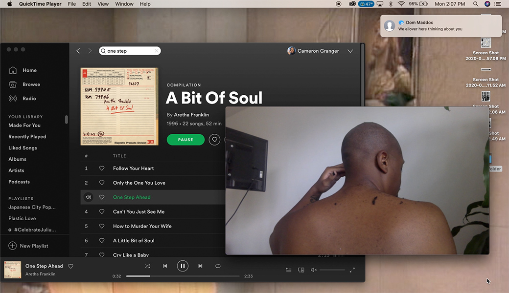 A computer desktop window has multiple windows open; Spotify plays the "A Bit Of Soul" by Aretha Franklin while a video of a man shaving his hair plays in the foreground.