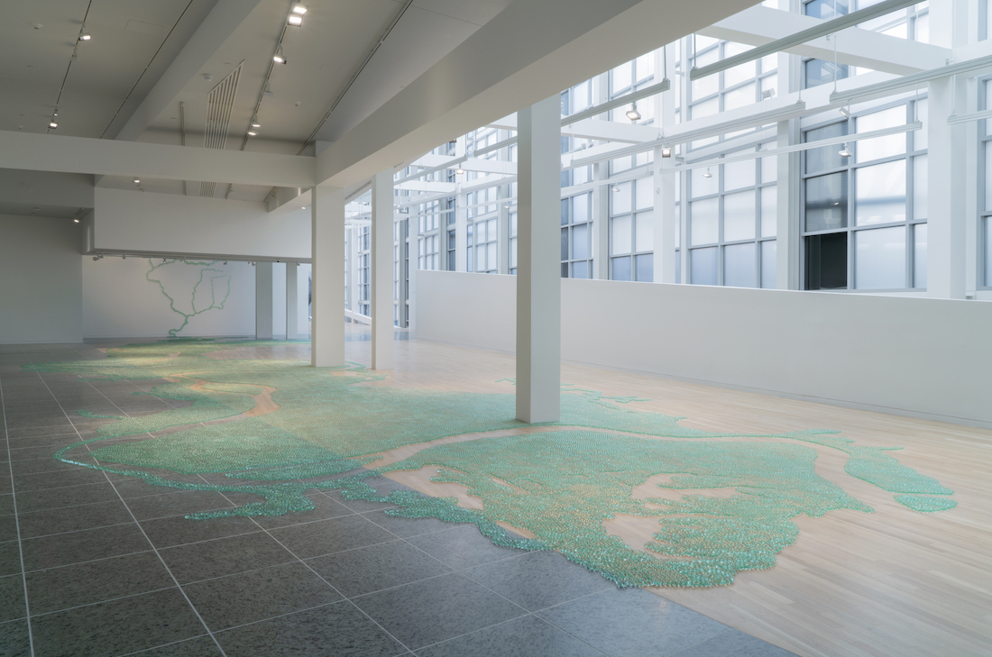 An installation shot of Maya Lin's depiction of the Ohio River confluence made entirely out of glass marbles adhered to the gallery floor