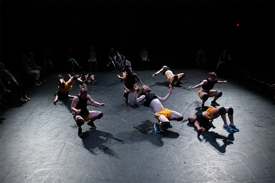 Overhead view of nine dancers