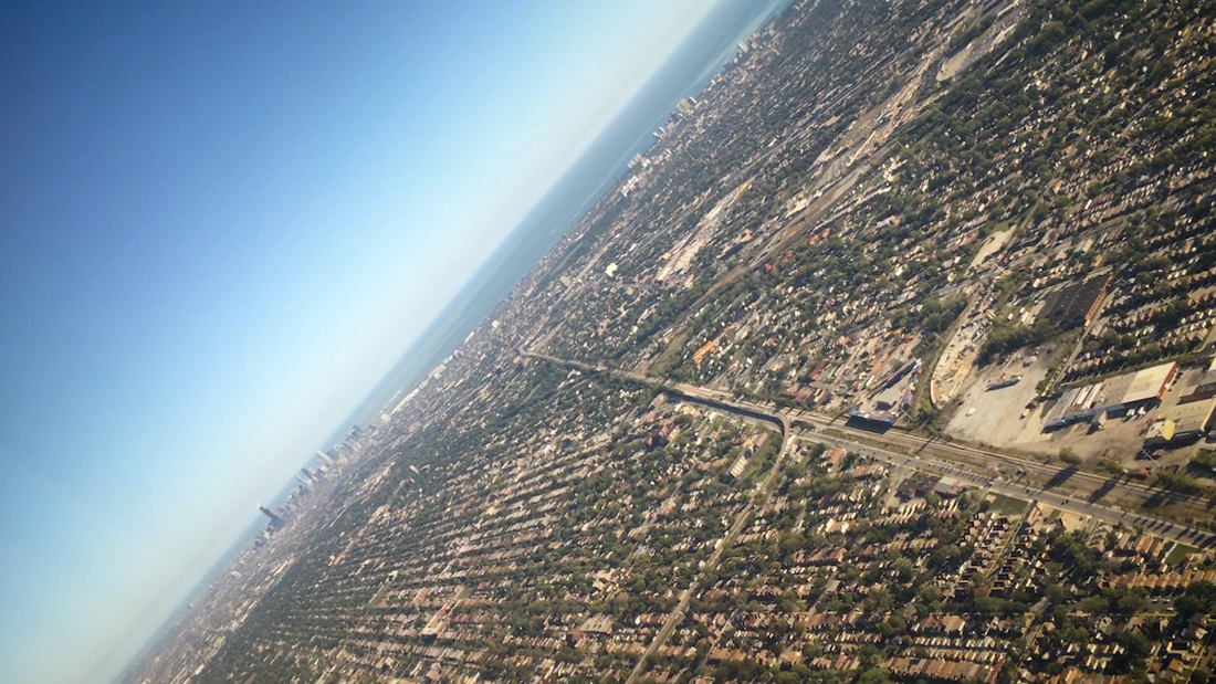 view of a densely populated suburban area from an airplane