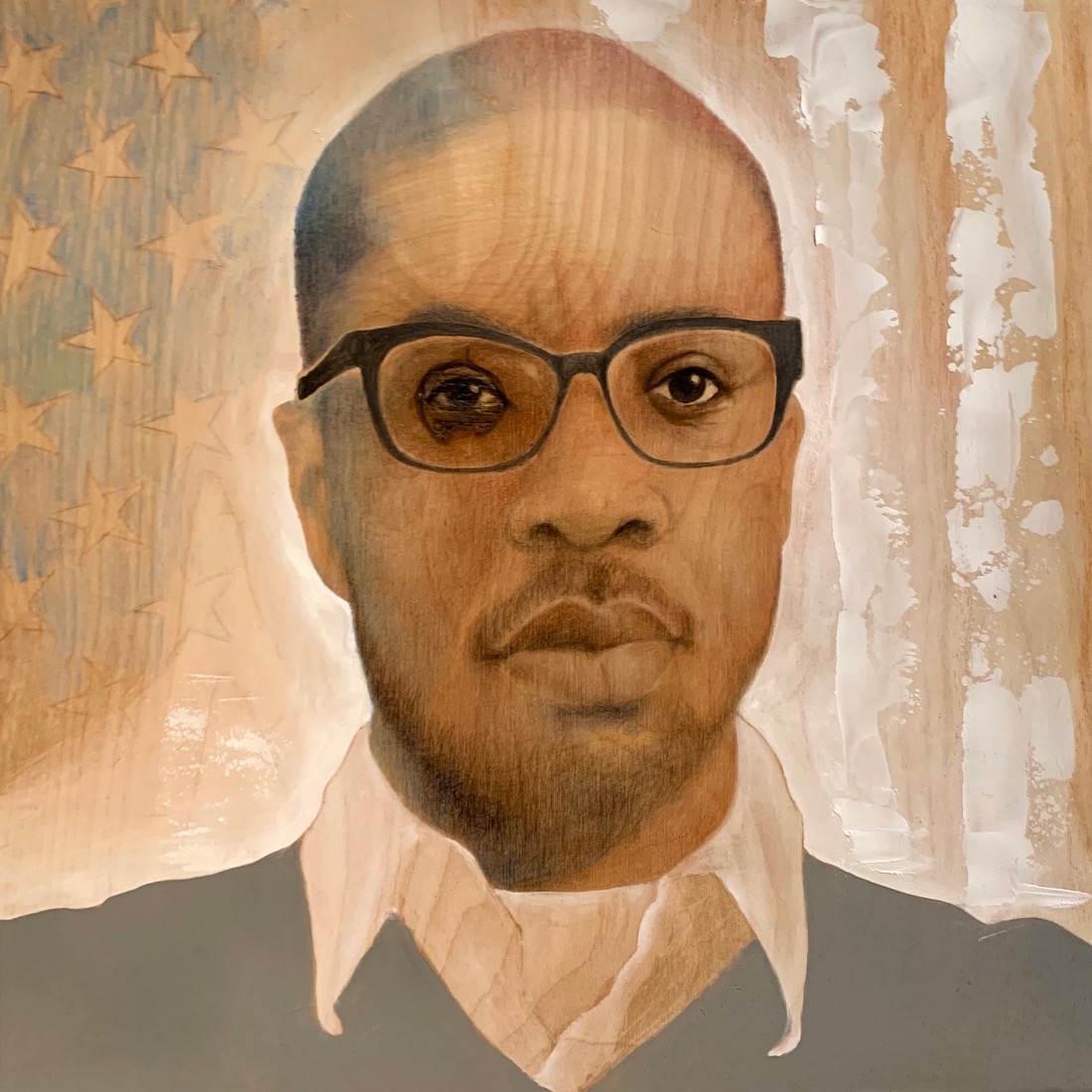 a painting of a Black man wearing glasses, a white collared shirt and green sweater against a light background of stars and stripes, with the wood grain of the painting surface incorporated into the composition