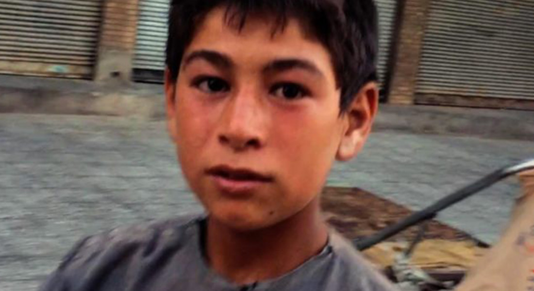 A young boy is pictured on the street