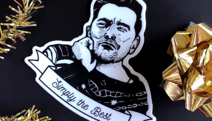 A black and white Shrinky Dink pin of Dan Levy from the series Schitt's Creek, made by Joanna Hammer of Dog Sweater Money