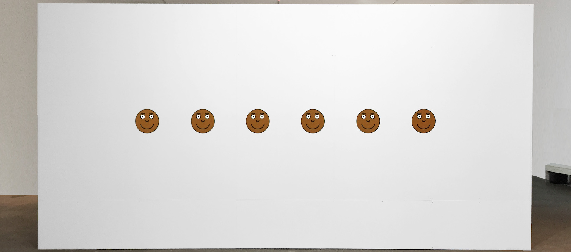 Artist Carolyn Lazard's Pain Scale, a series of round simple drawings mimicking the pain scale graphics used in hospitals, but in this case all faces have brown skin and all wear the same smile