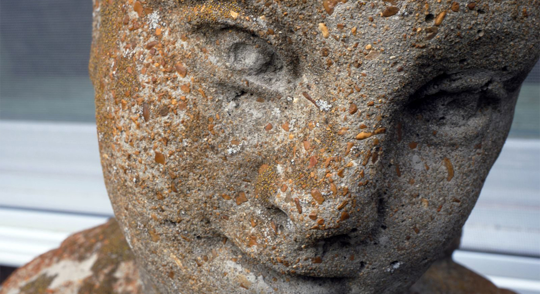 A stone sculpture of Helen Keller's face
