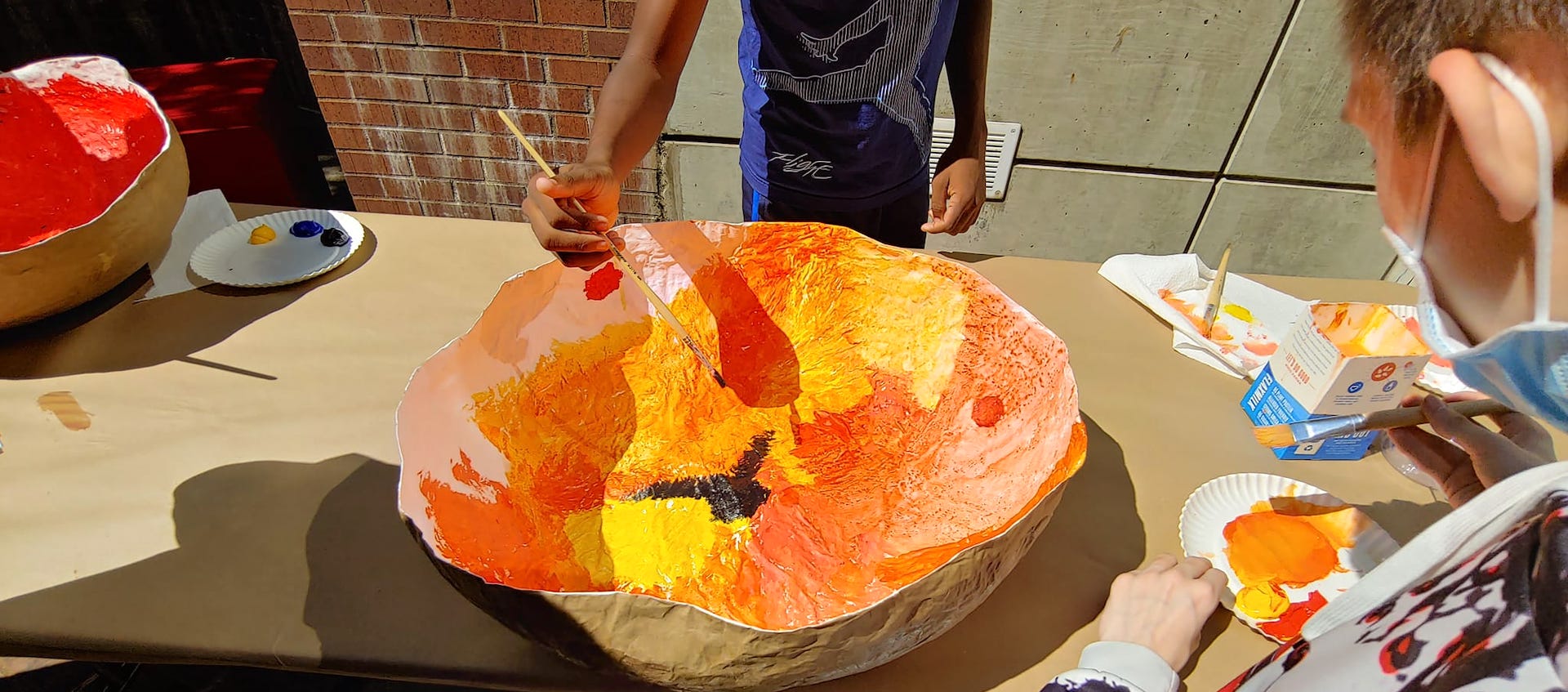 Papier mache bowl being painted at the Wexner Center for the Arts