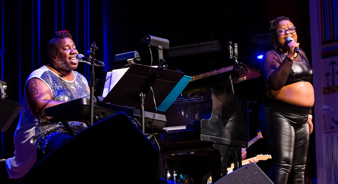 Sharon Udoh and Paisha Thomas perform together on the Lincoln Theatre stage