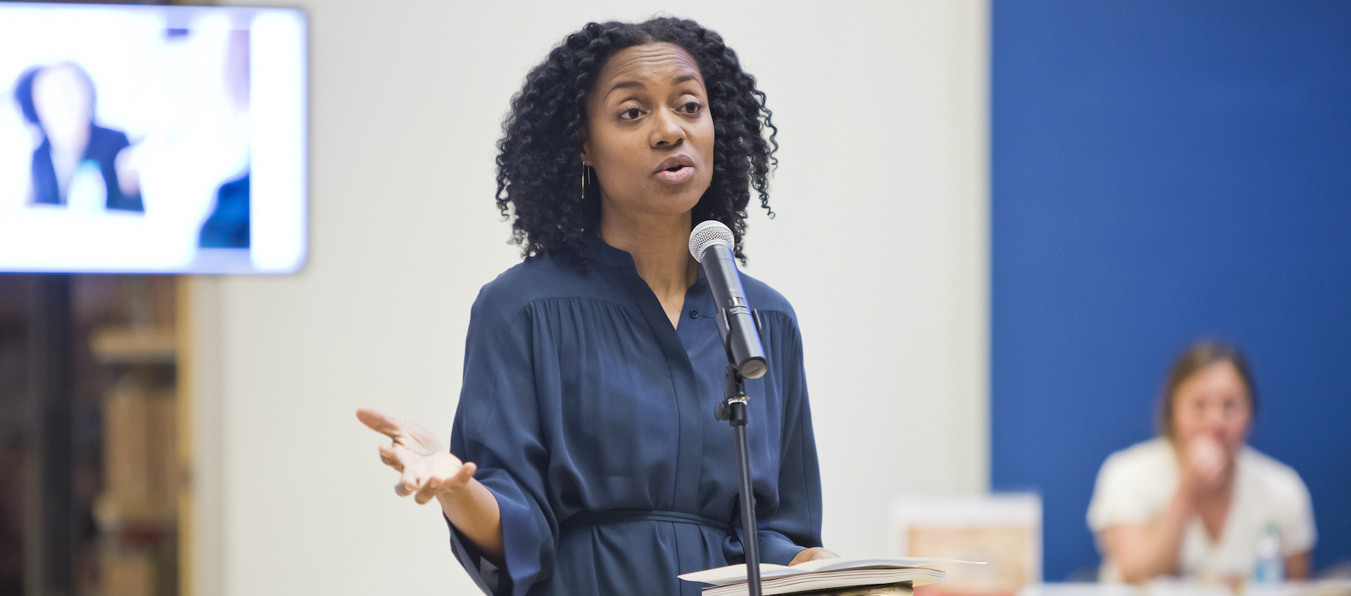 Dionne Custer Edwards speaking in the Wexner Center lobby in 2018