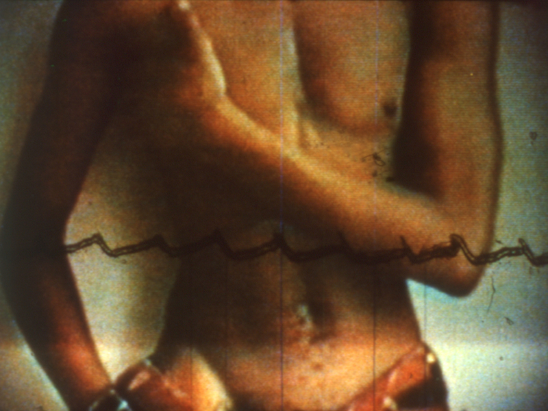 A shirtless torso, with the left arm draped over the chest and the right arm resting on the hip