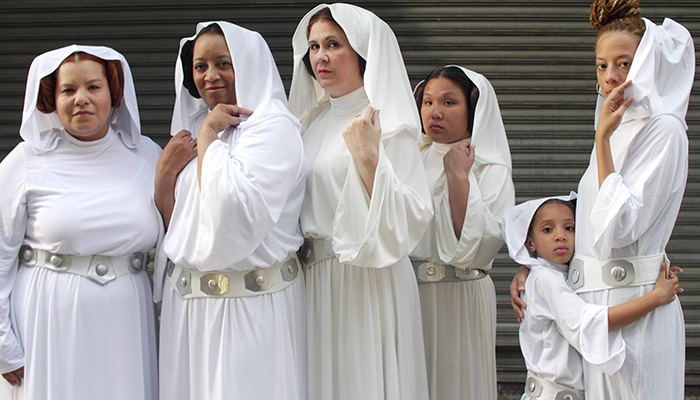 A group of five people and one child dressed as Princess Leia