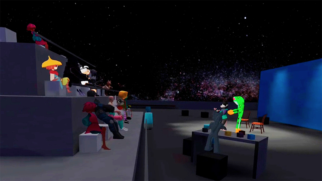 In a computer-animated still a humanoid frog and rodent address a crowd of other animated creatures from a stage on the right of the image; a blank blue screen is at the back of the stage
