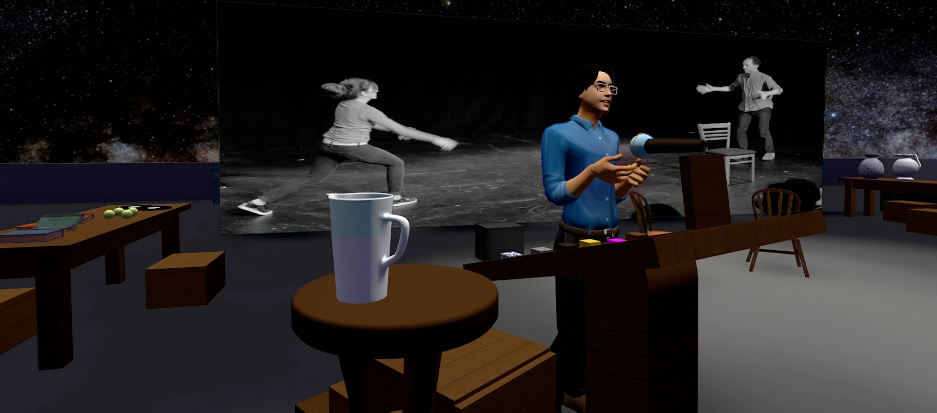 In a computer-animated still a person in a blue shirt and glasses seems to speak into a microphone on a virtual stage; a photograph of two actors interacting is in the background