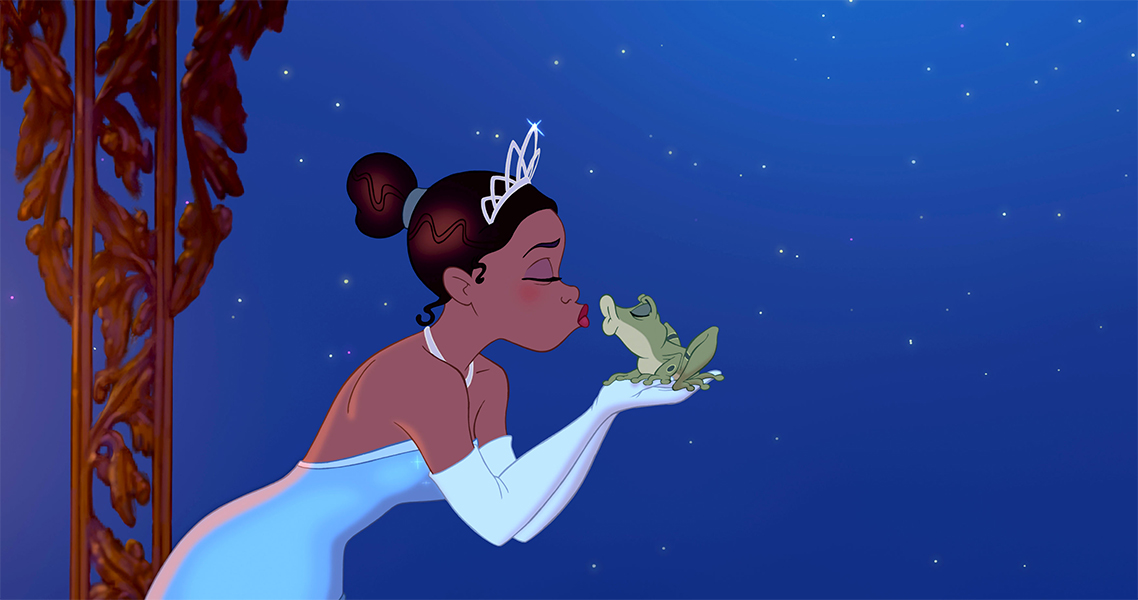 Image from Disney's The Princess and the Frog featuring the princess holding and kissing the frog in front of the starry night sky