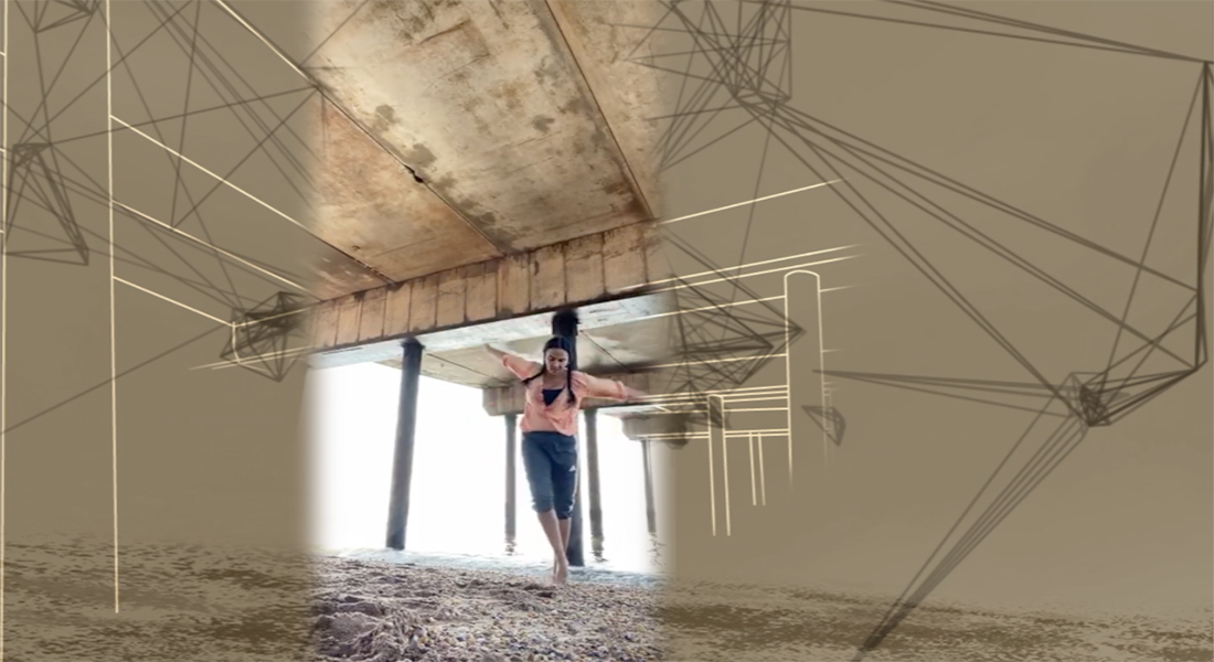 Photo of a person with dark hair in pigtails dancing with arms outstretched in the sand under a bridge on the shoreline. There are animated geometric designs added to the bridge and surroundings in the photo.  