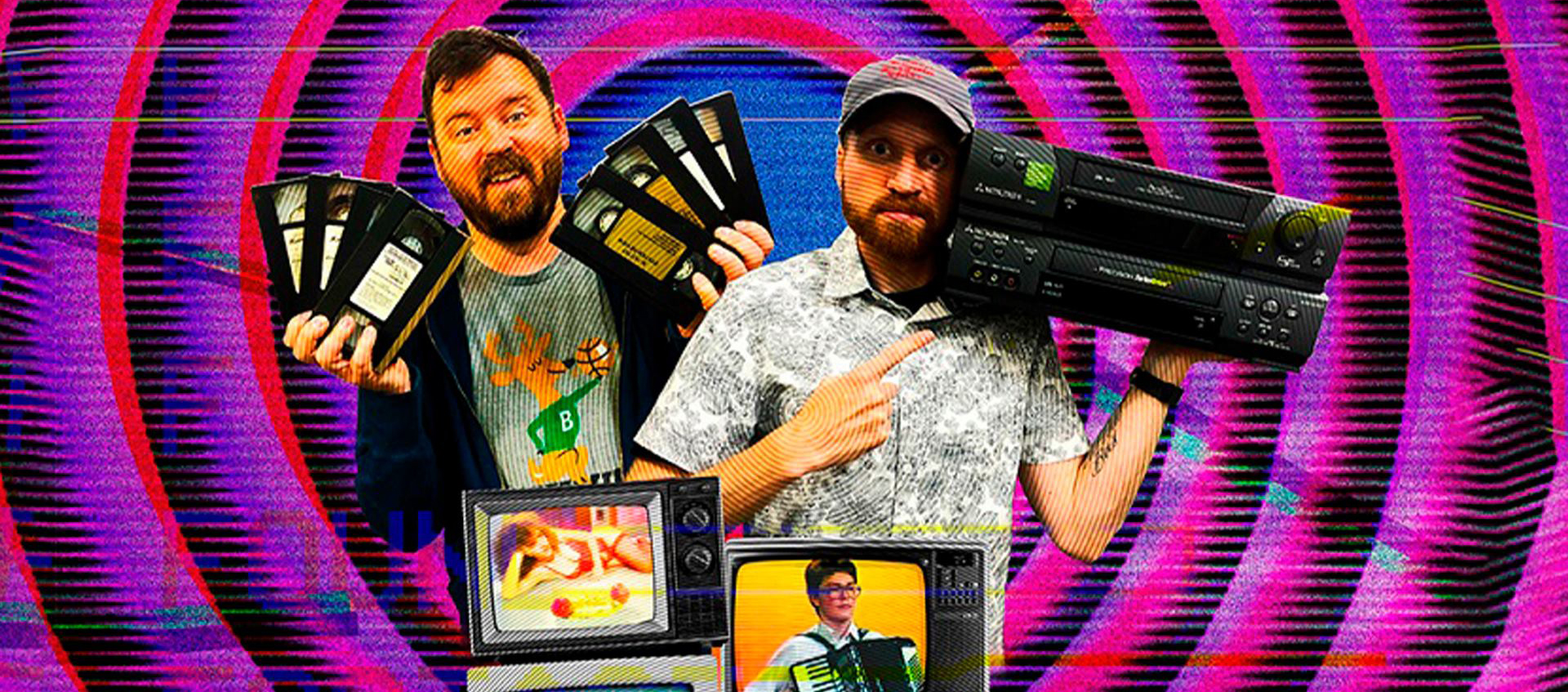 A bearded man holds three VHS tapes in each hand and next to him is a man in ball cap holding a VCR, below them are three televisions