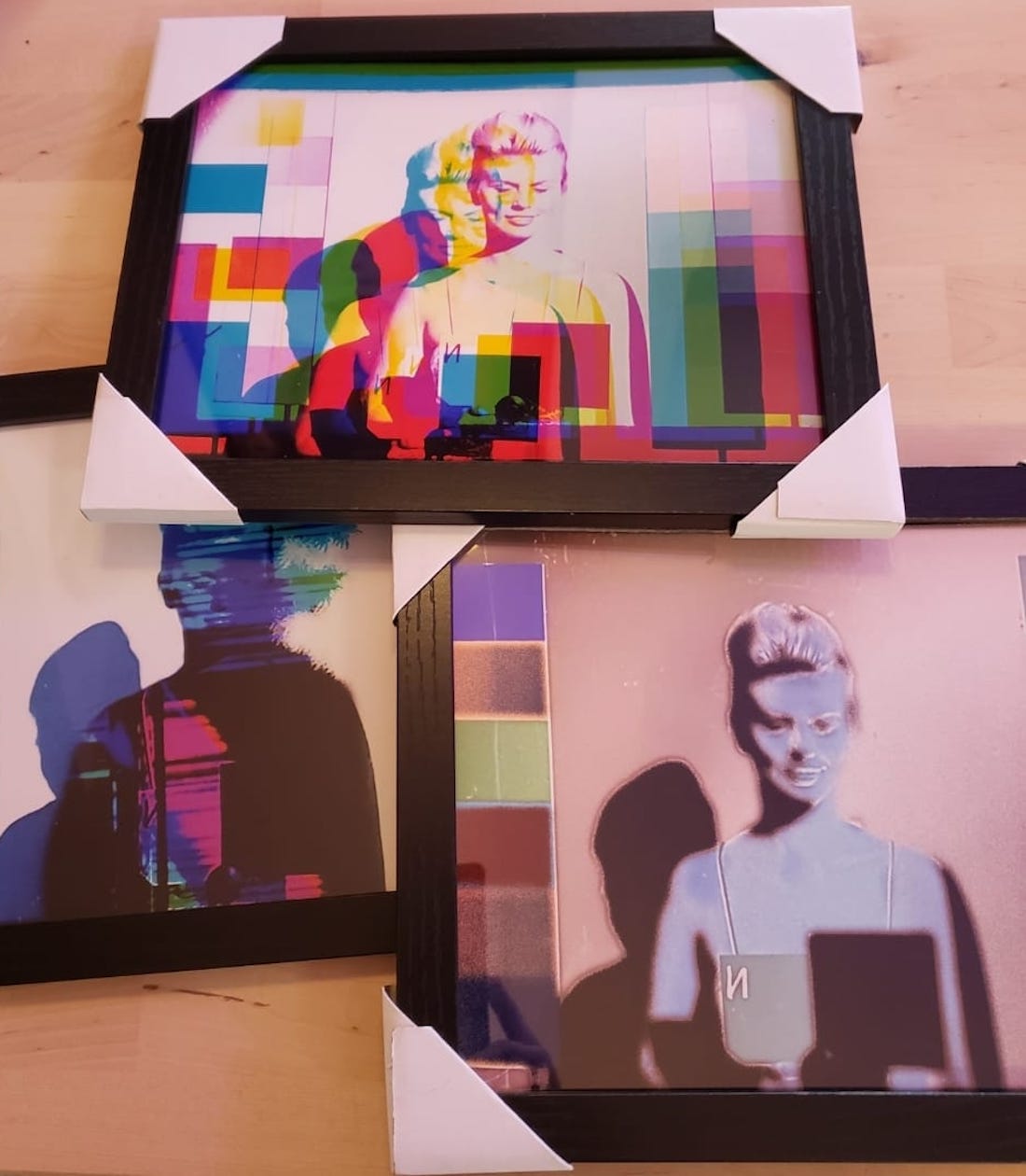 Framed, manipulated images of "leader ladies" by artist Rachael Barbash