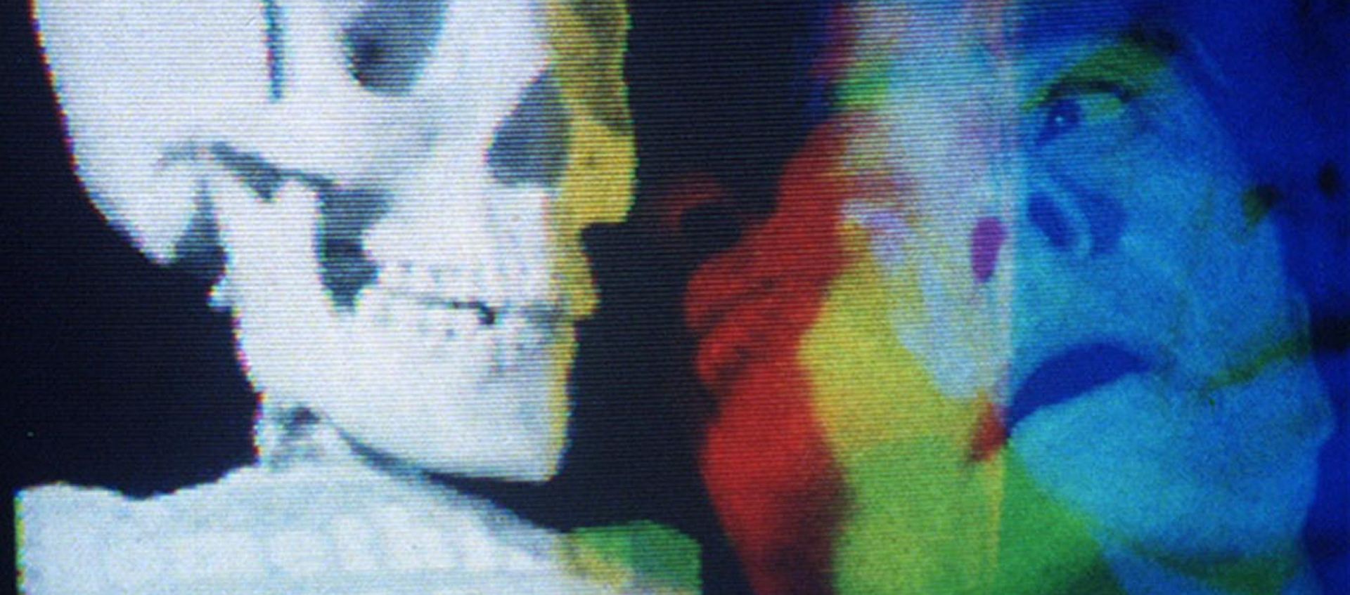 A distorted, multicolored image of a skeleton on the left and Barbara Hammer, who appears in multiple exposures and colors, on the right.