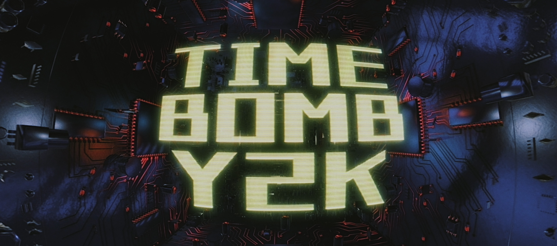  “TIME BOMB Y2K” in block yellow letters stylized to like digital screens surrounded by graphics that look like computer chips.  