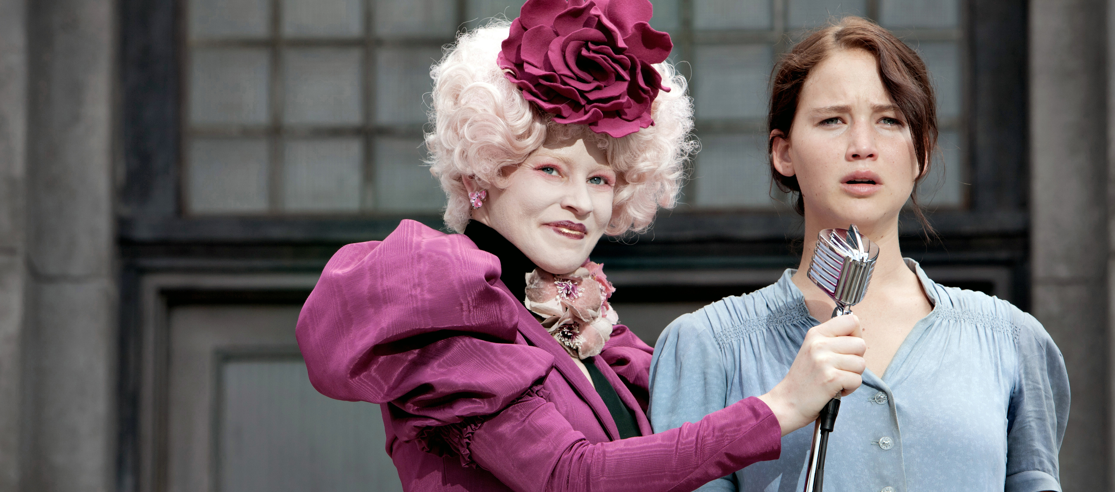 A still from The Hunger Games of Effie Trinket and Katniss Everdeen.