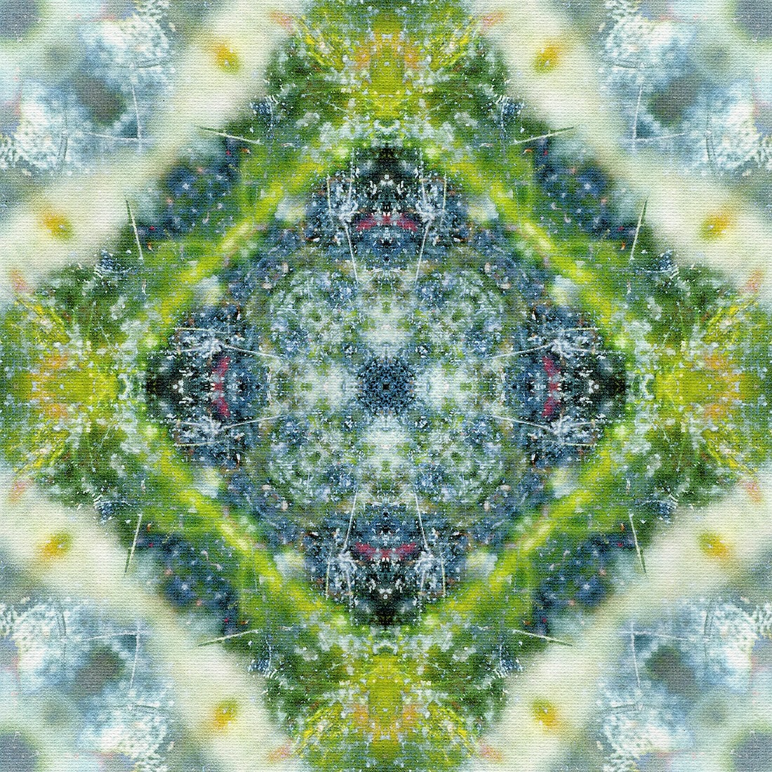 A diamond-shaped kaleidoscopic image, mostly in shades of green, blue, and white.