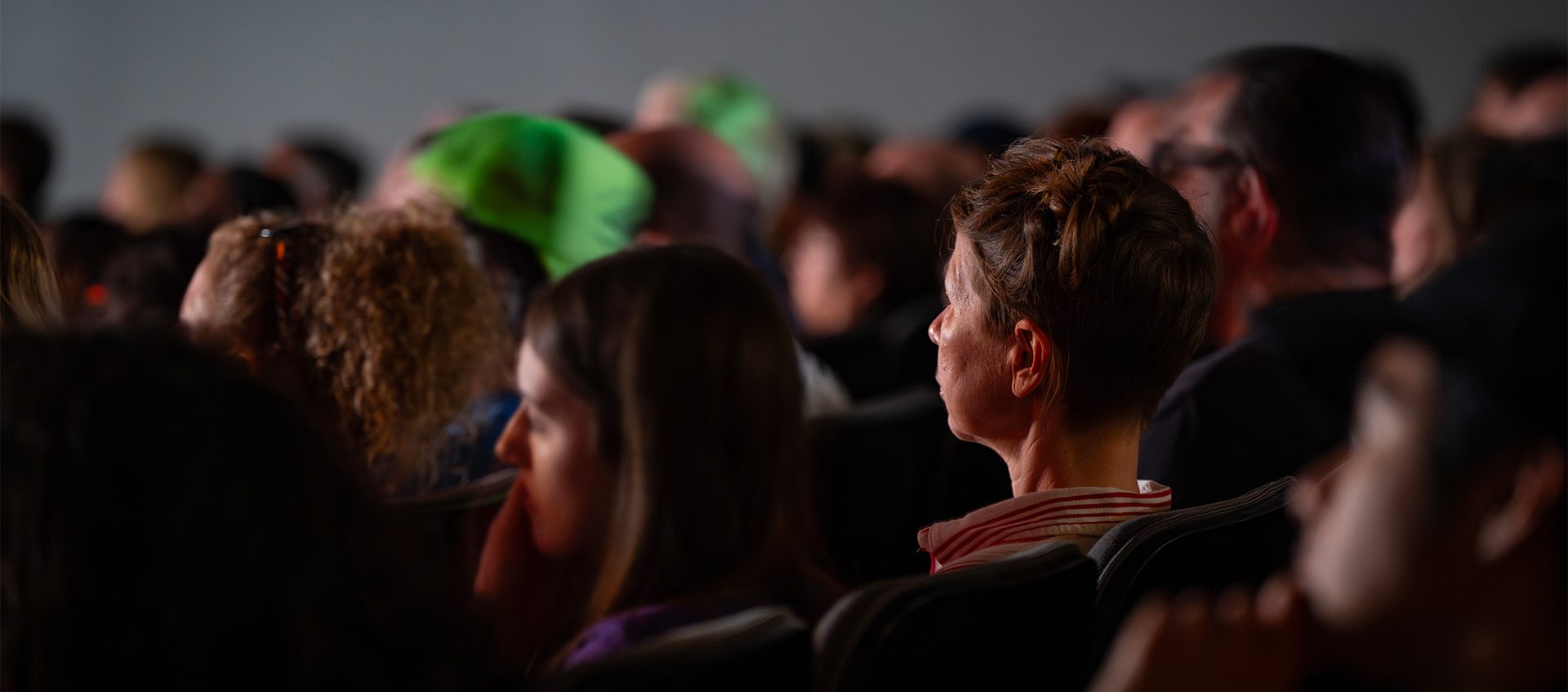 A movie theater with a full audience.