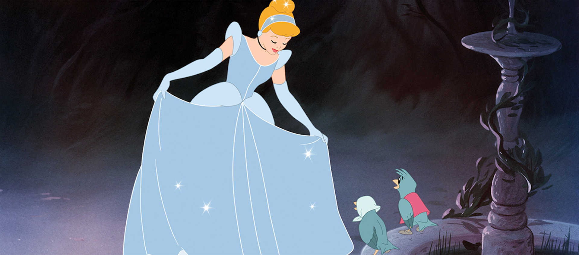 Cinderella wears her sparkly ballgown and curtsies to a pair of birds who sit on the rim of a fountain.  