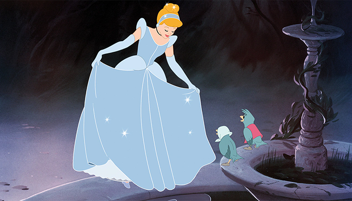 Cinderella wears her sparkly ballgown and curtsies to a pair of birds who sit on the rim of a fountain.